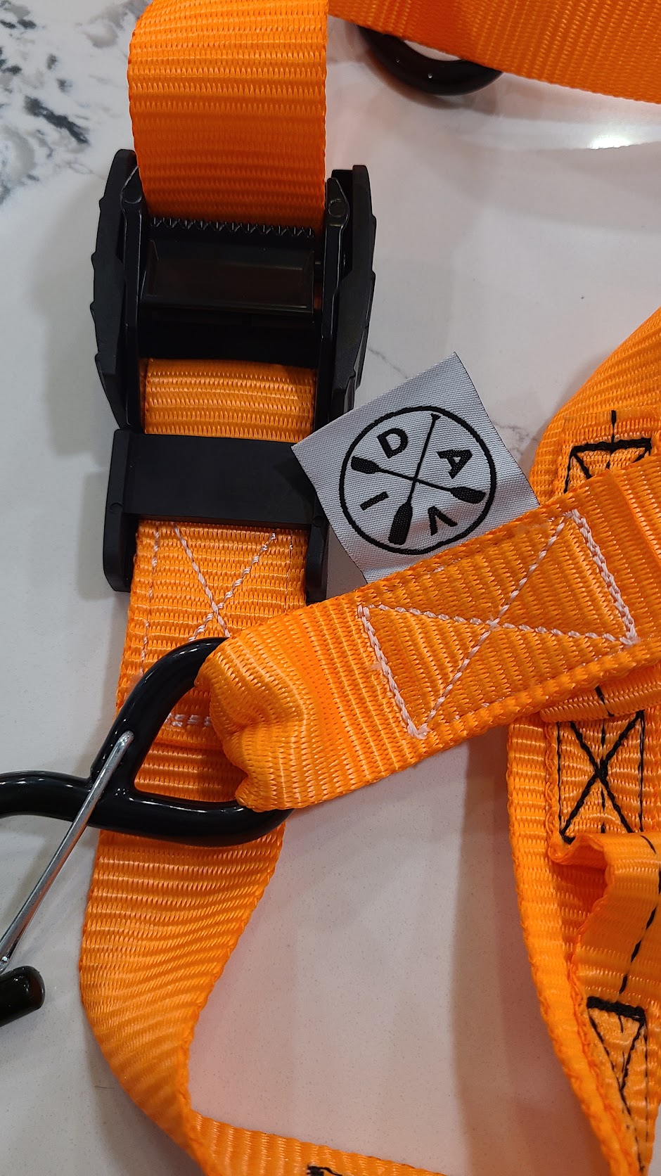 Close detail of Avid SUP strap hardware, stitching and branding